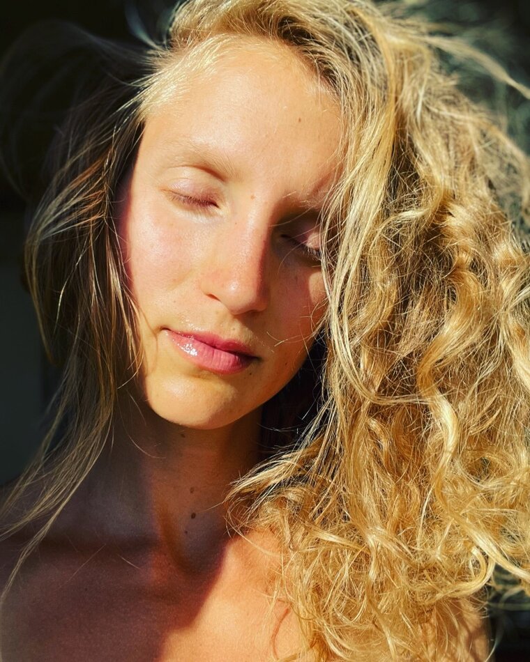 Face of a woman in the sun